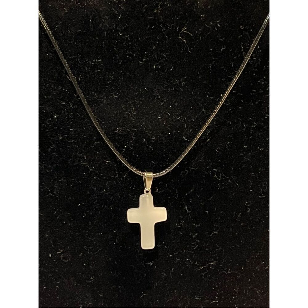 White Stone Cross on a Black Necklace Cord